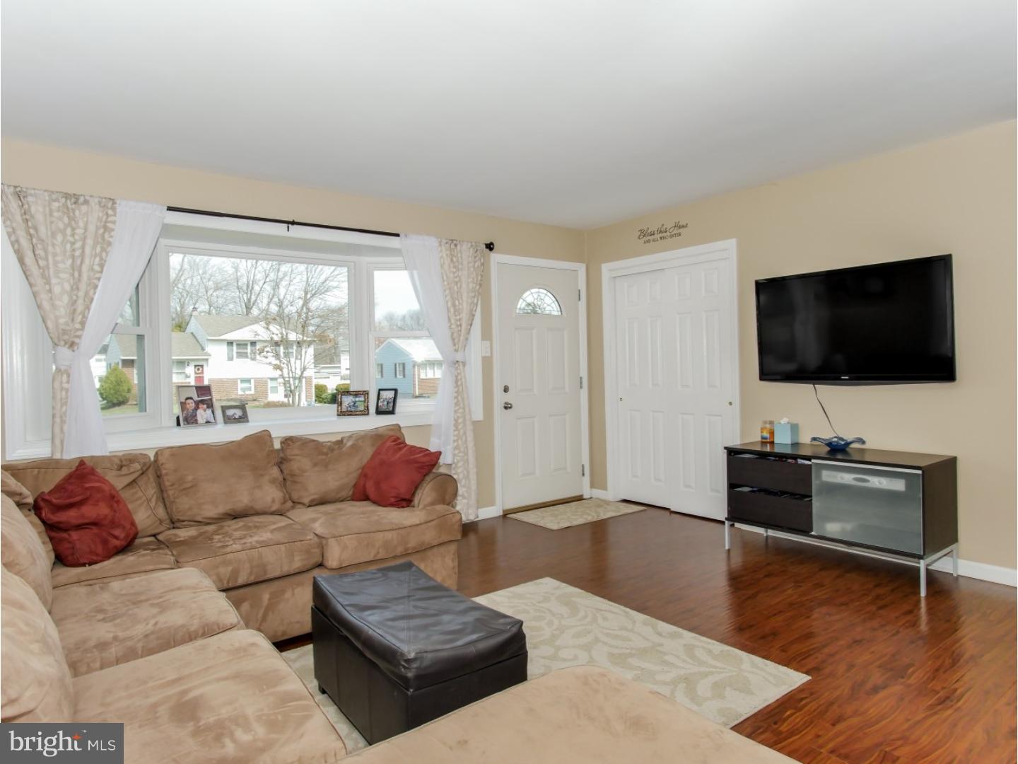 604 Exton Road Hatboro, PA 19040 - Photo 7 of 21 a living room with furniture and a flat screen tv