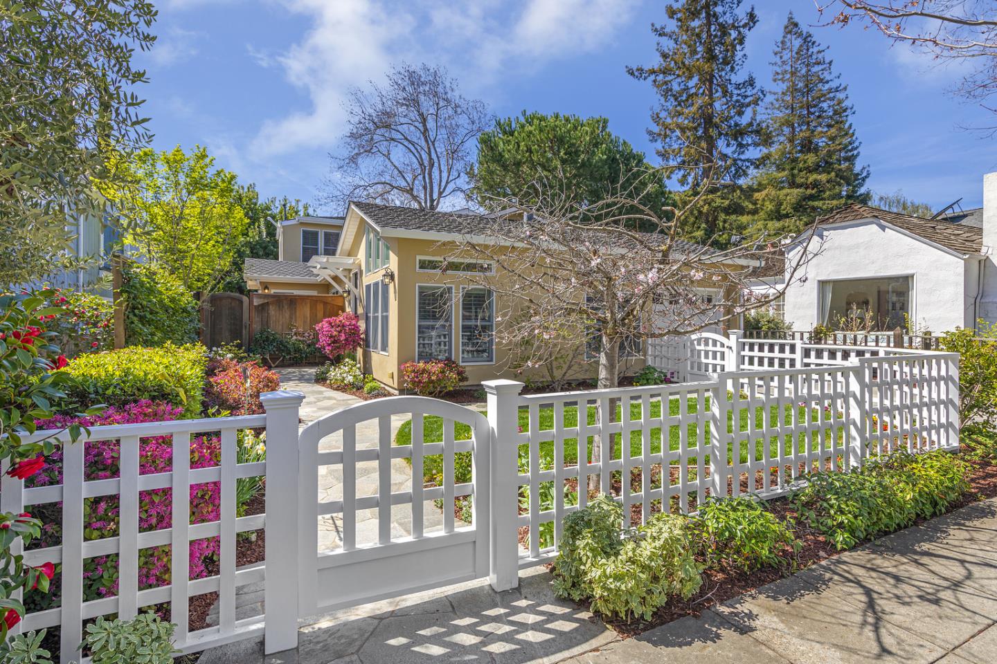 a front view of a house with a garden