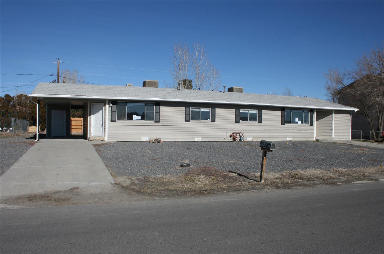 a front view of a house with a outdoor space