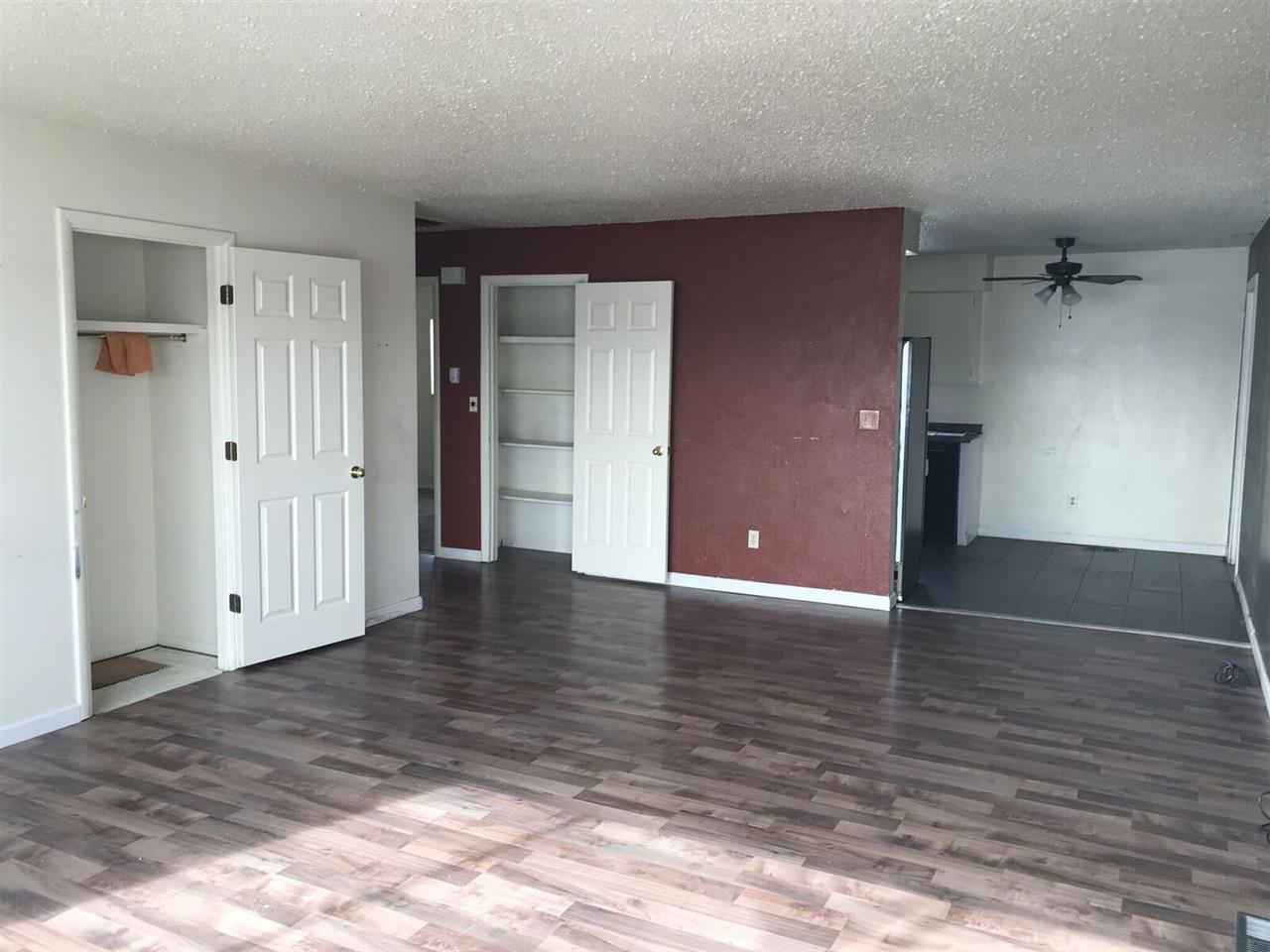 3240 D D 1/4 Road, Unit A&B Clifton, CO 81520 - Photo 11 of 19 a view of an empty room with wooden floor and closet