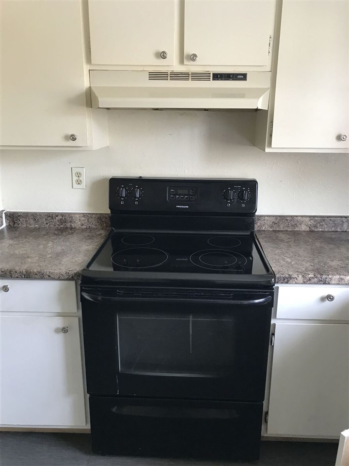 3240 D D 1/4 Road, Unit A&B Clifton, CO 81520 - Photo 13 of 19 a stove top oven sitting inside of a kitchen