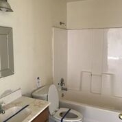 3240 D D 1/4 Road, Unit A&B Clifton, CO 81520 - Photo 16 of 19 a bathroom with a granite countertop sink and a bathtub