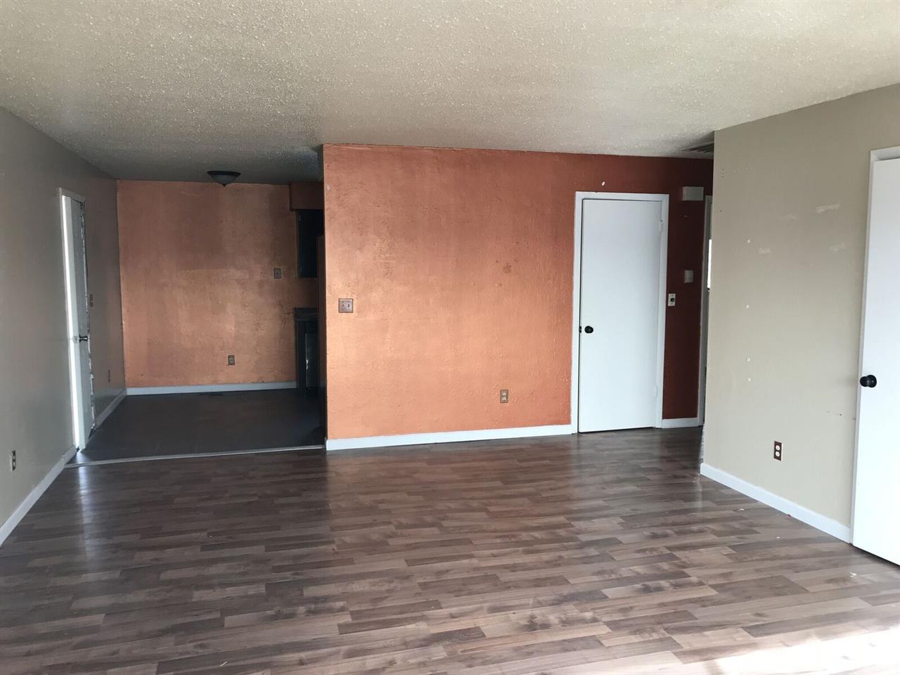3240 D D 1/4 Road, Unit A&B Clifton, CO 81520 - Photo 4 of 19 a view of an empty room with wooden floor