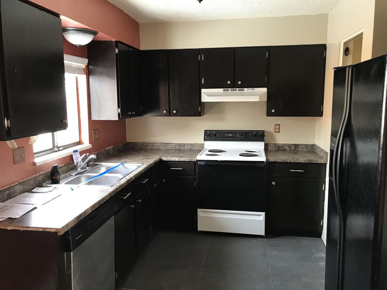 3240 D D 1/4 Road, Unit A&B Clifton, CO 81520 - Photo 6 of 19 a kitchen with a sink and a refrigerator