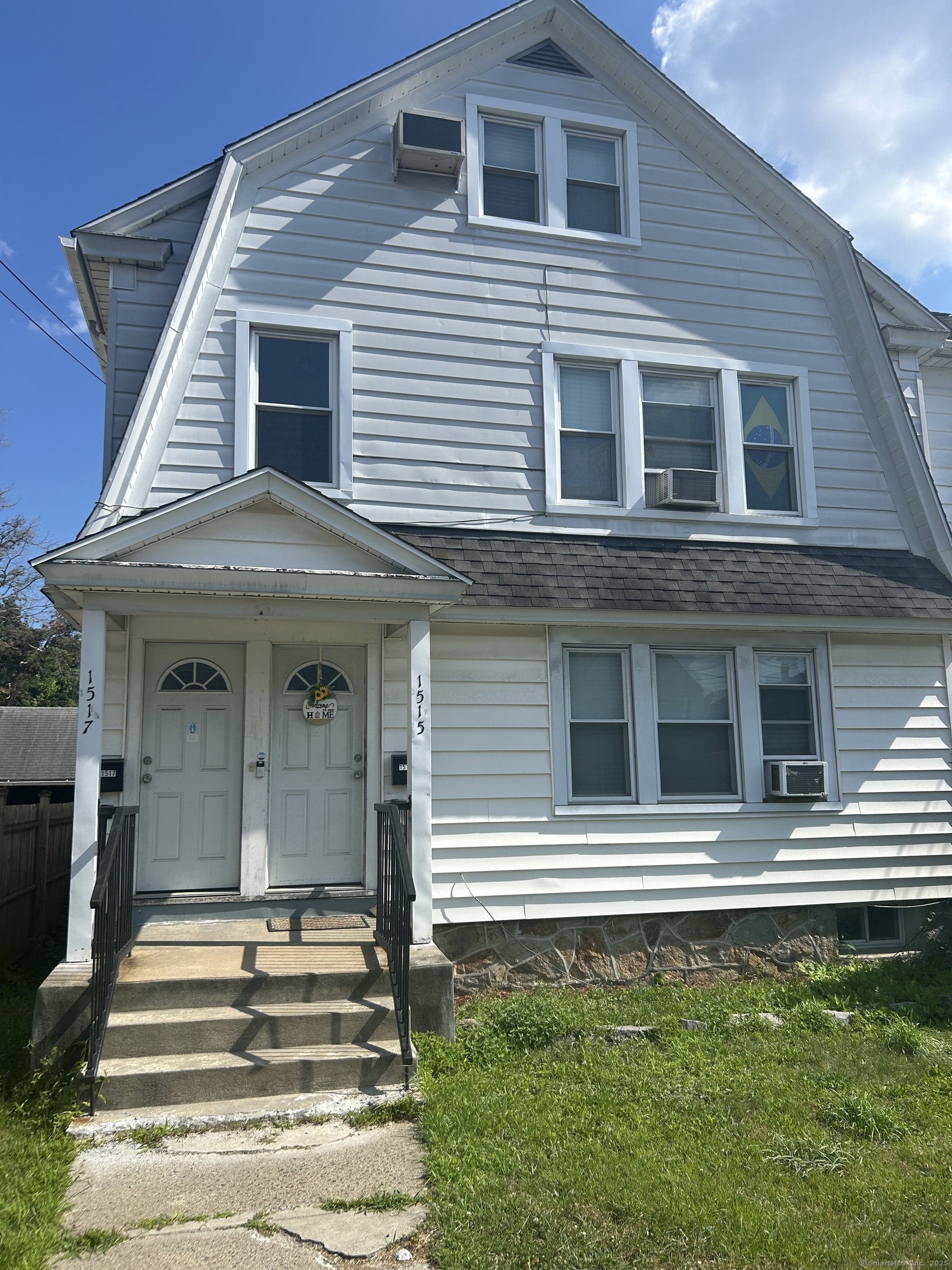 1515 Capitol Avenue Bridgeport, CT 06604 - Photo 2 of 17 a view of a house with a balcony and stairs