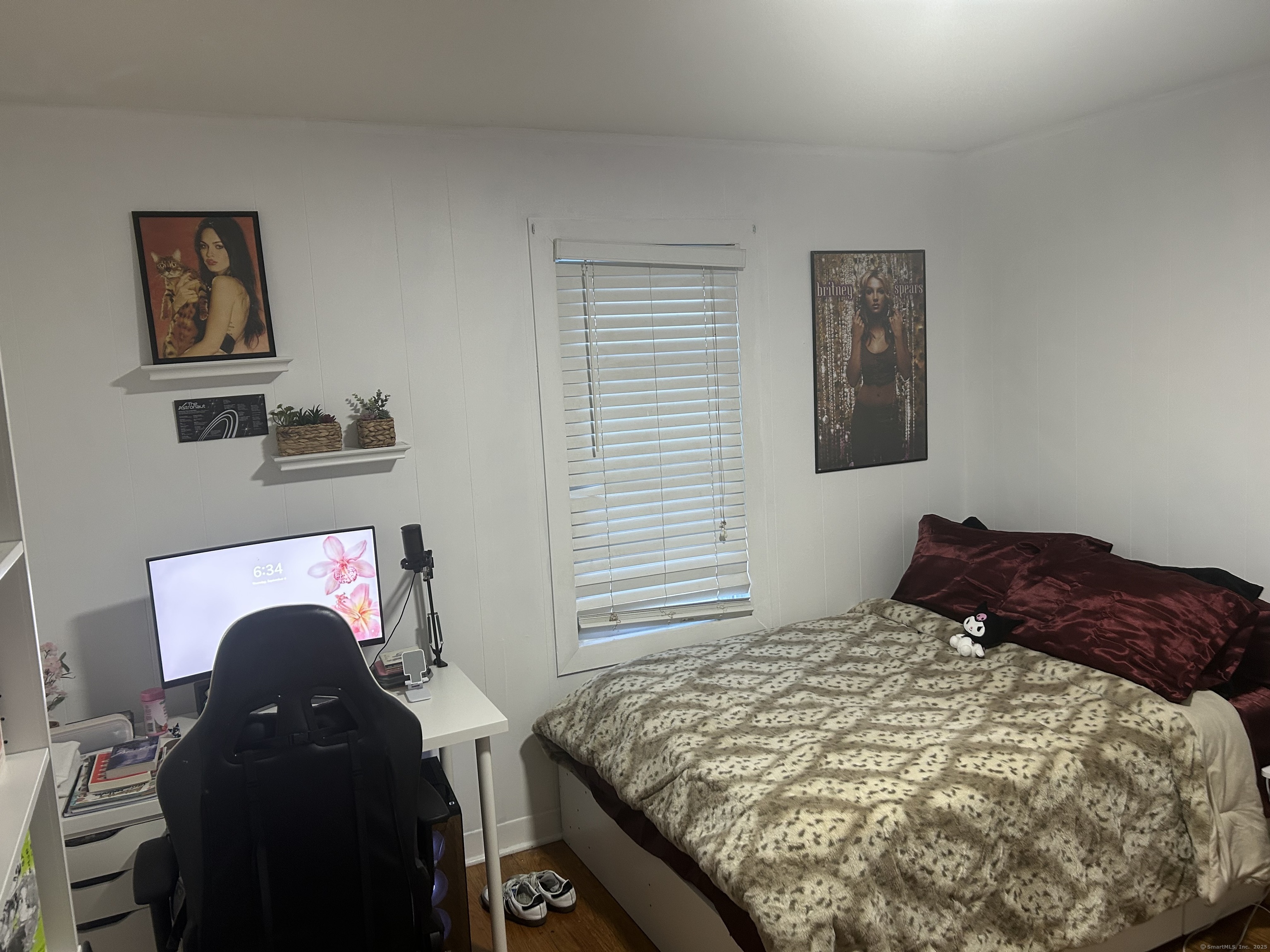 1515 Capitol Avenue Bridgeport, CT 06604 - Photo 8 of 17 a bedroom with a bed and a painting on the wall