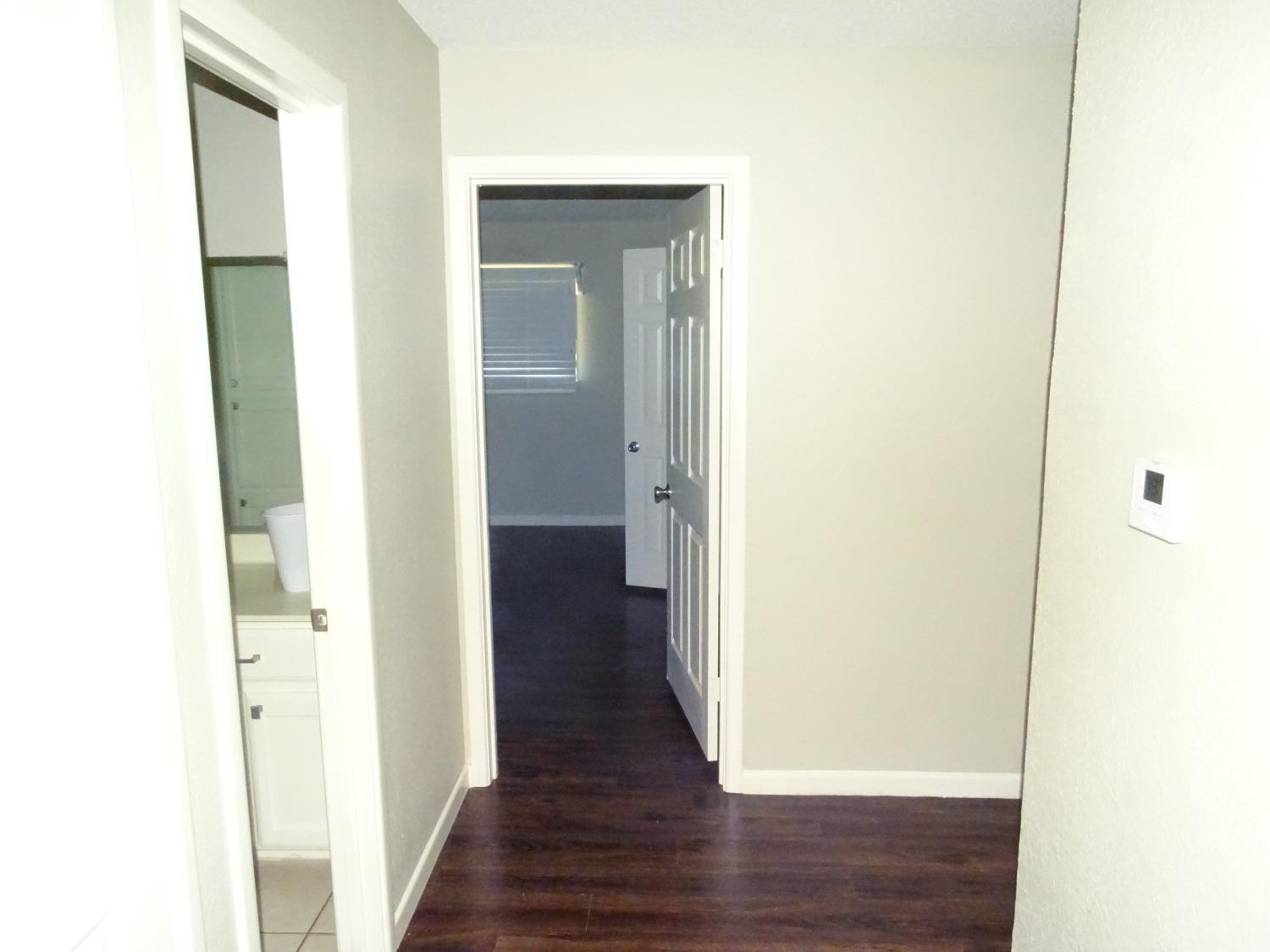 4920 17th Street Lubbock, TX 79416 - Photo 11 of 33 a view of a hallway with wooden floor
