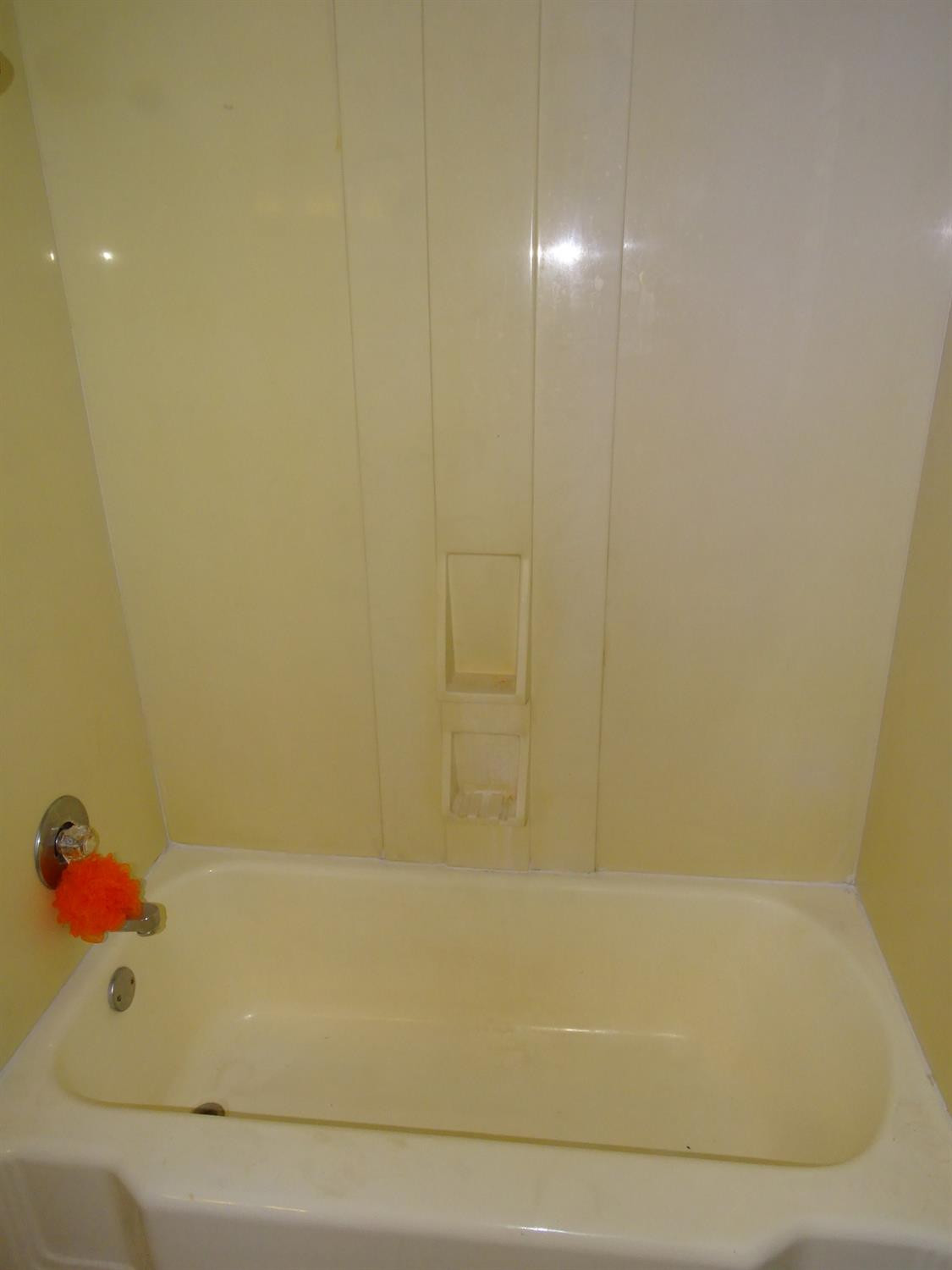 4920 17th Street Lubbock, TX 79416 - Photo 14 of 33 a bathroom with a bathtub