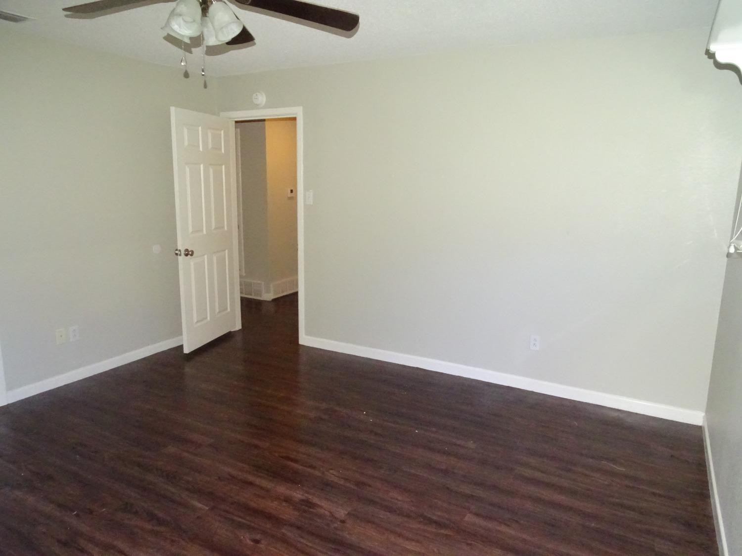 4920 17th Street Lubbock, TX 79416 - Photo 18 of 33 a view of an empty room with wooden floor