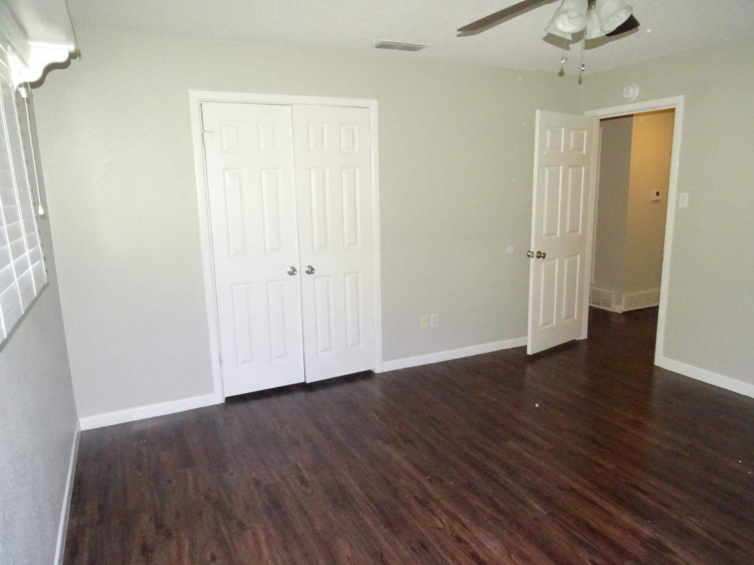 4920 17th Street Lubbock, TX 79416 - Photo 19 of 33 a view of an empty room with wooden floor
