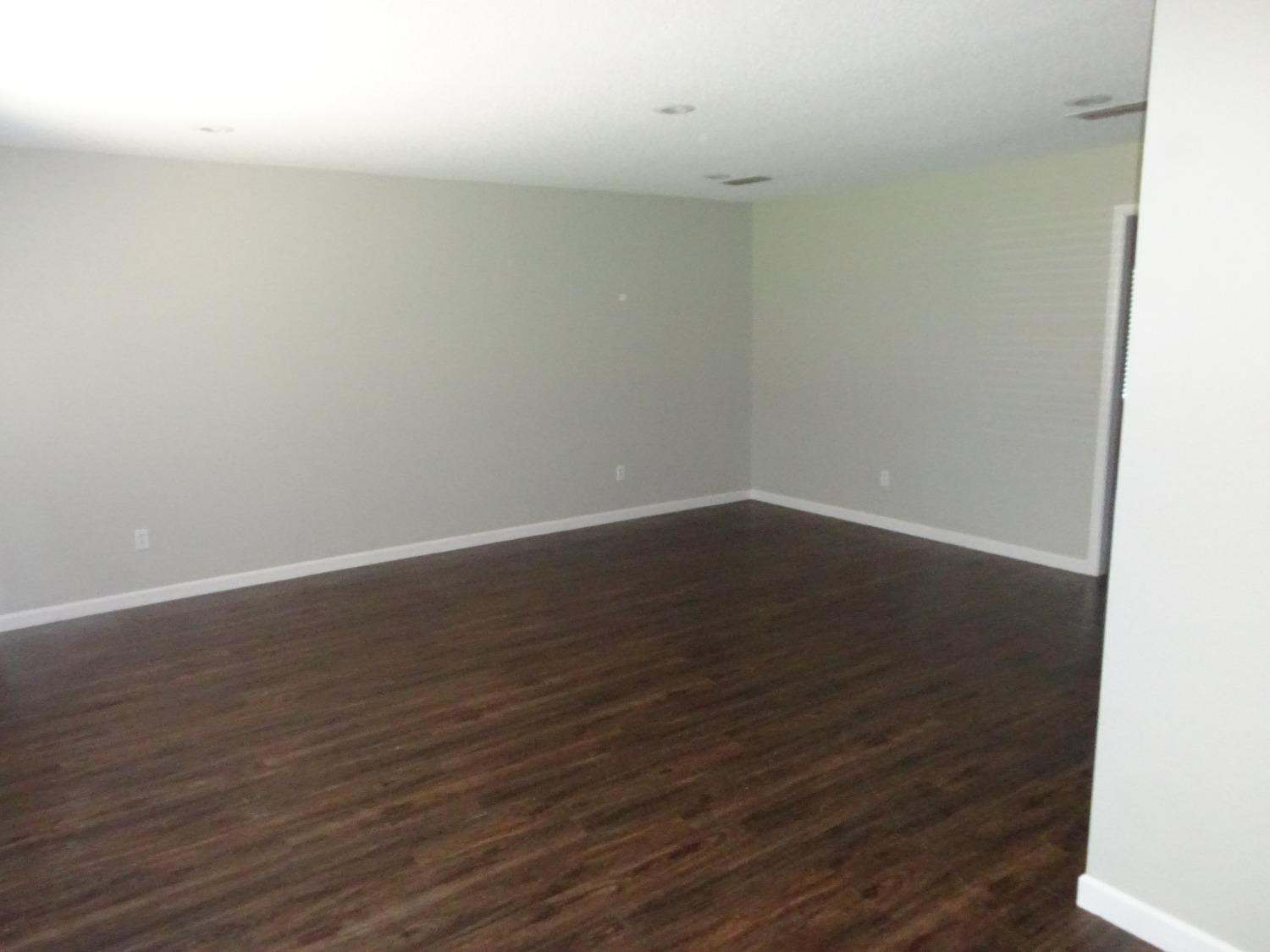 4920 17th Street Lubbock, TX 79416 - Photo 3 of 33 a view of a room with wooden floor