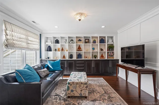 a bedroom with a bed a couch and dresser