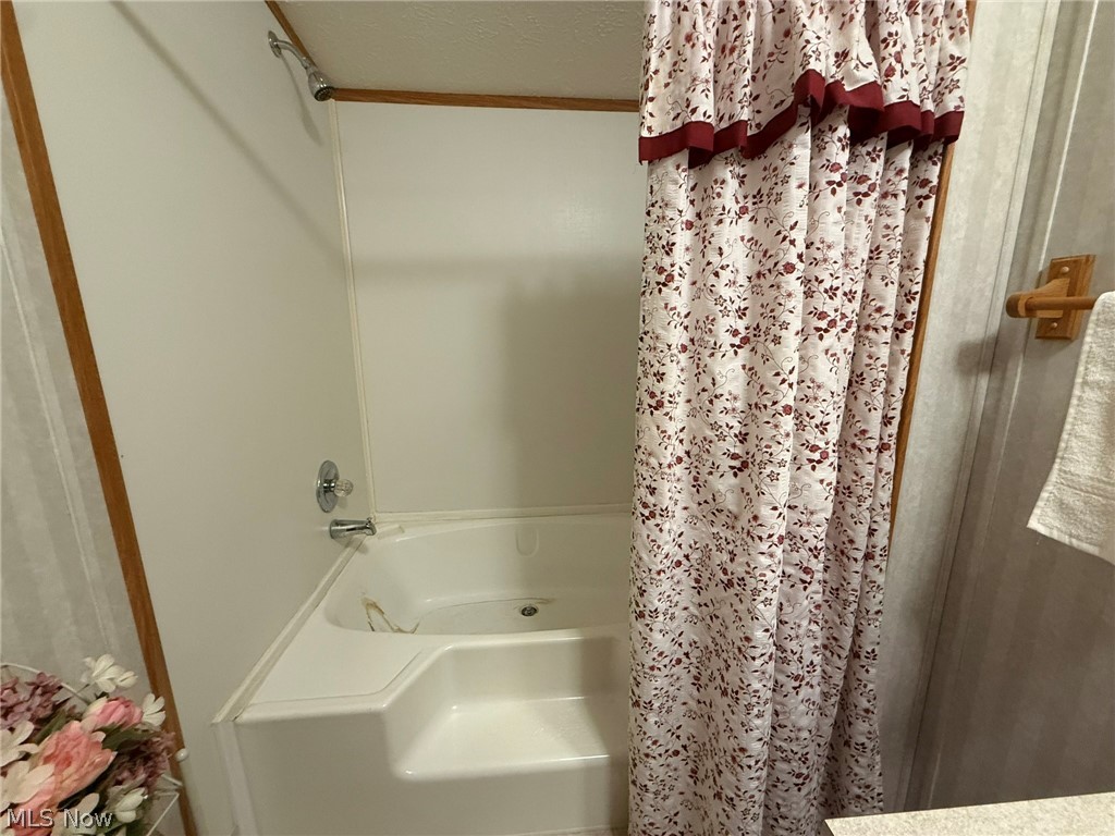 2933 Rabbit Drive Dennison, OH 44621 - Photo 21 of 28 Full bathroom with a textured ceiling and shower / tub combo