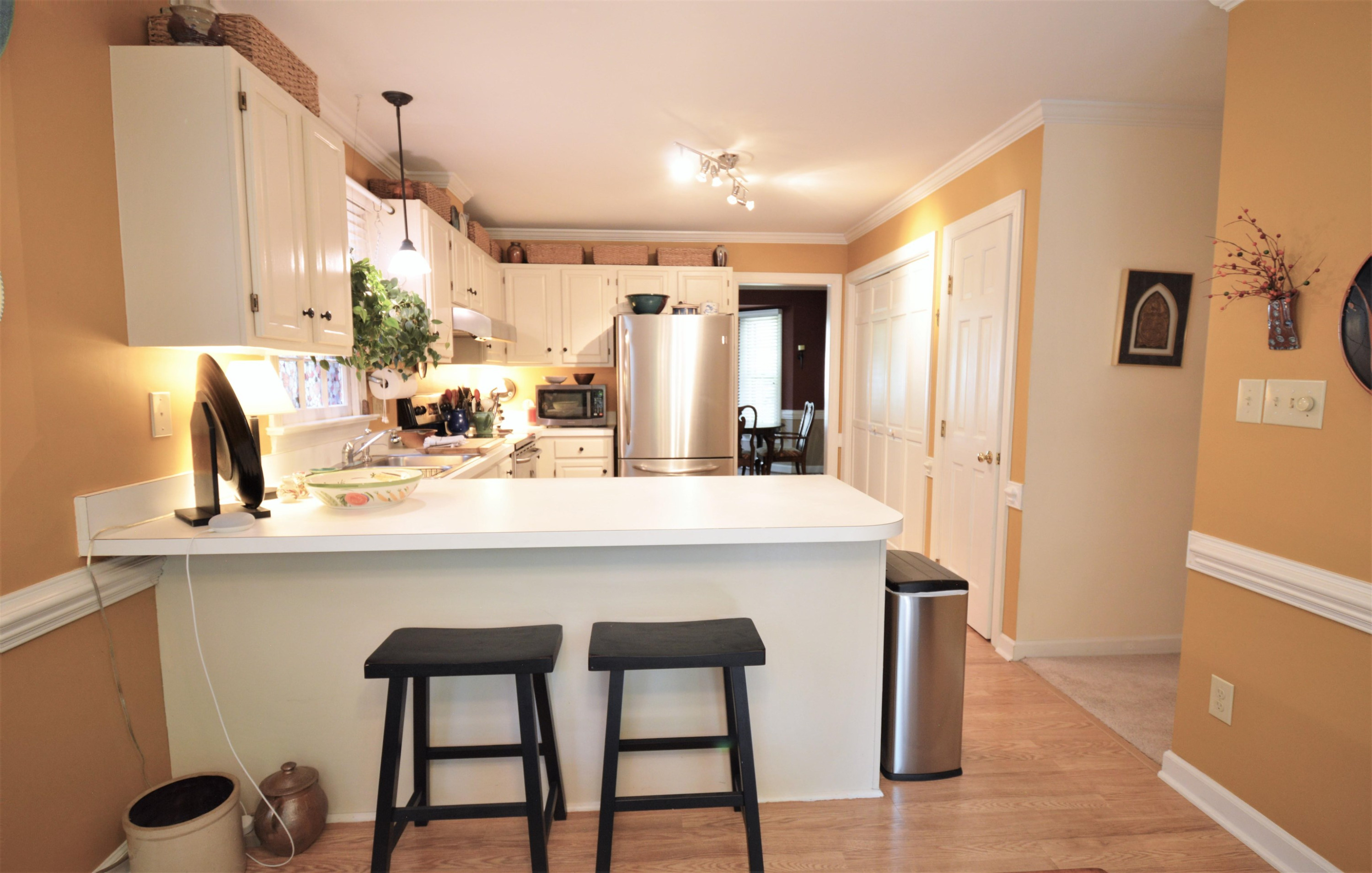 7008 Sandringham Drive Raleigh, NC 27613 - Photo 10 of 52 Lots of counterspace plus a breakfast bar and pantry. Kitchen