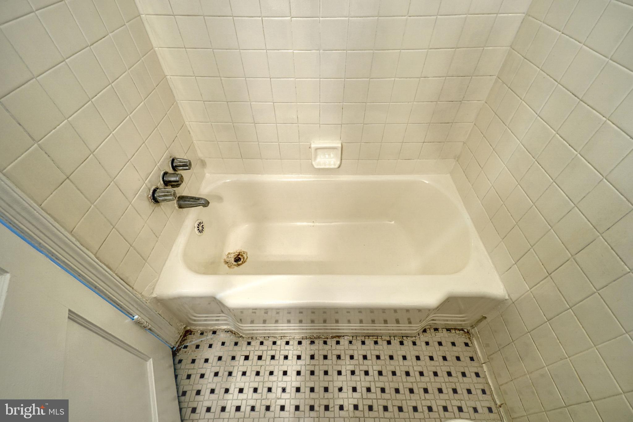 1238 Simms Place Northeast, Unit A Washington, DC 20002 - Photo 12 of 18 a bathroom with a bathtub
