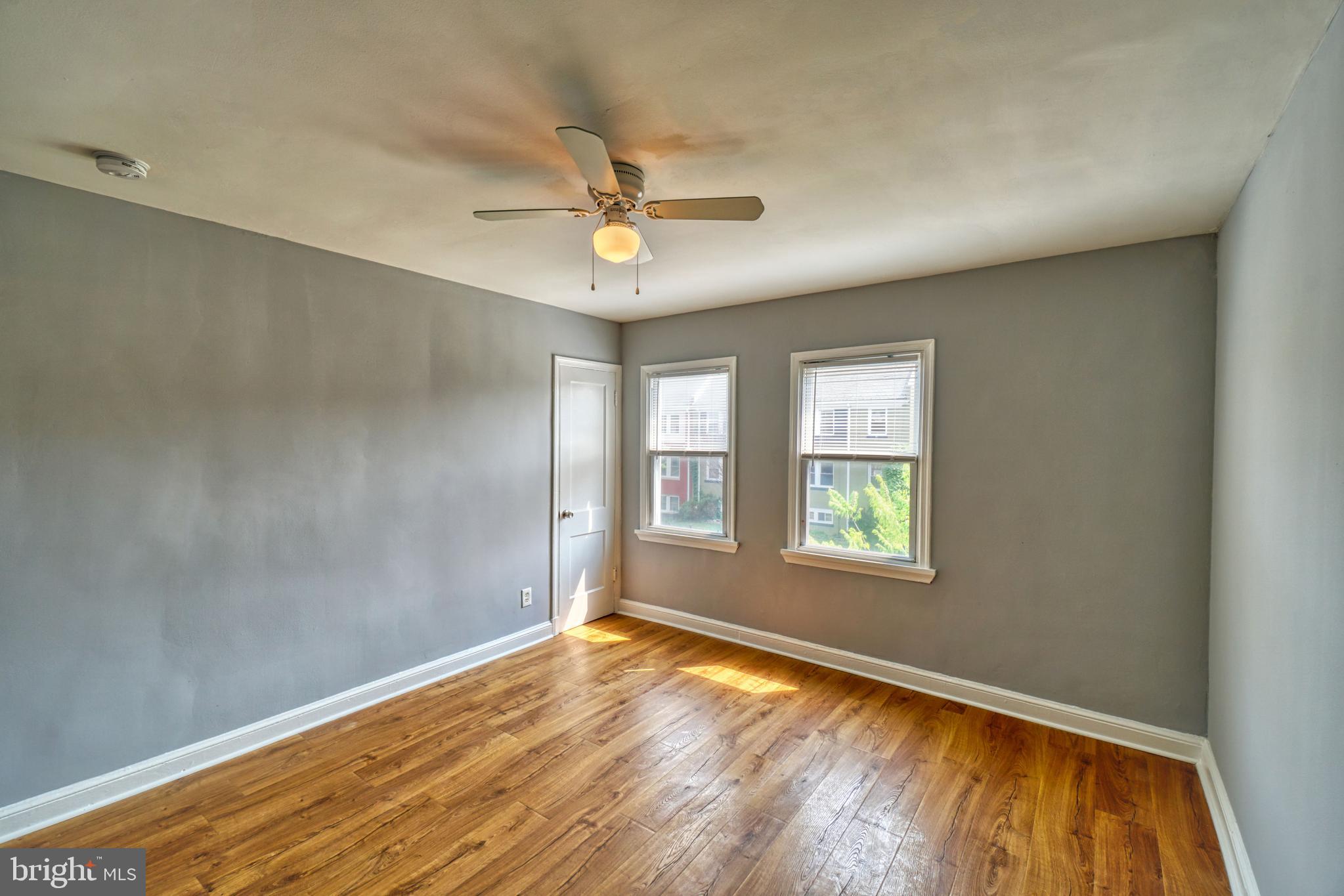 1238 Simms Place Northeast, Unit A Washington, DC 20002 - Photo 15 of 18 a view of empty room with wooden floor and fan