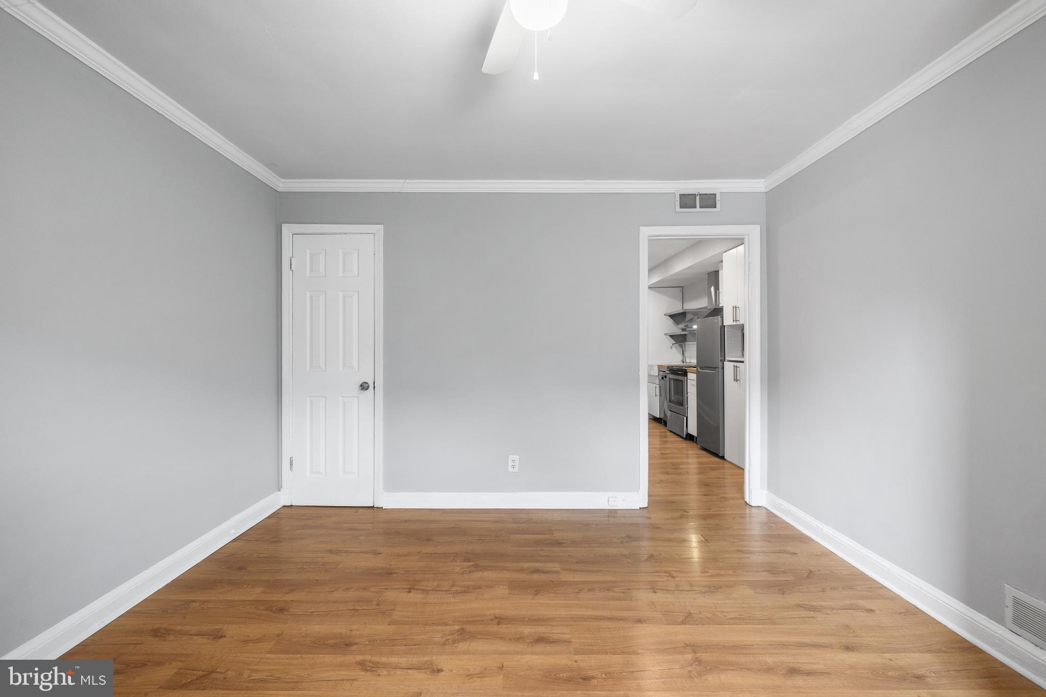 1238 Simms Place Northeast, Unit A Washington, DC 20002 - Photo 4 of 16 a view of an empty room with wooden floor