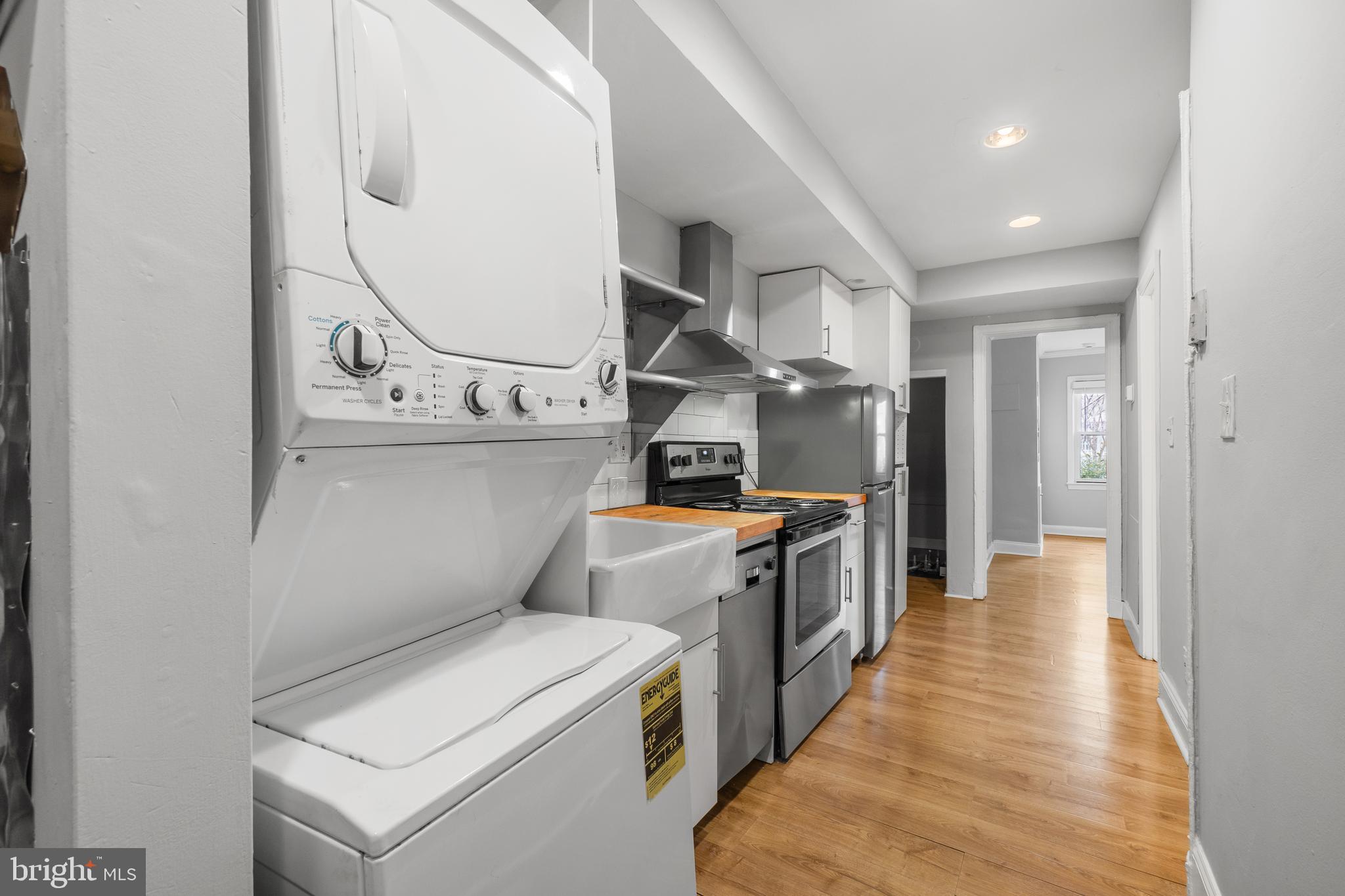 1238 Simms Place Northeast, Unit A Washington, DC 20002 - Photo 7 of 16 a view of a kitchen with utility room and windows