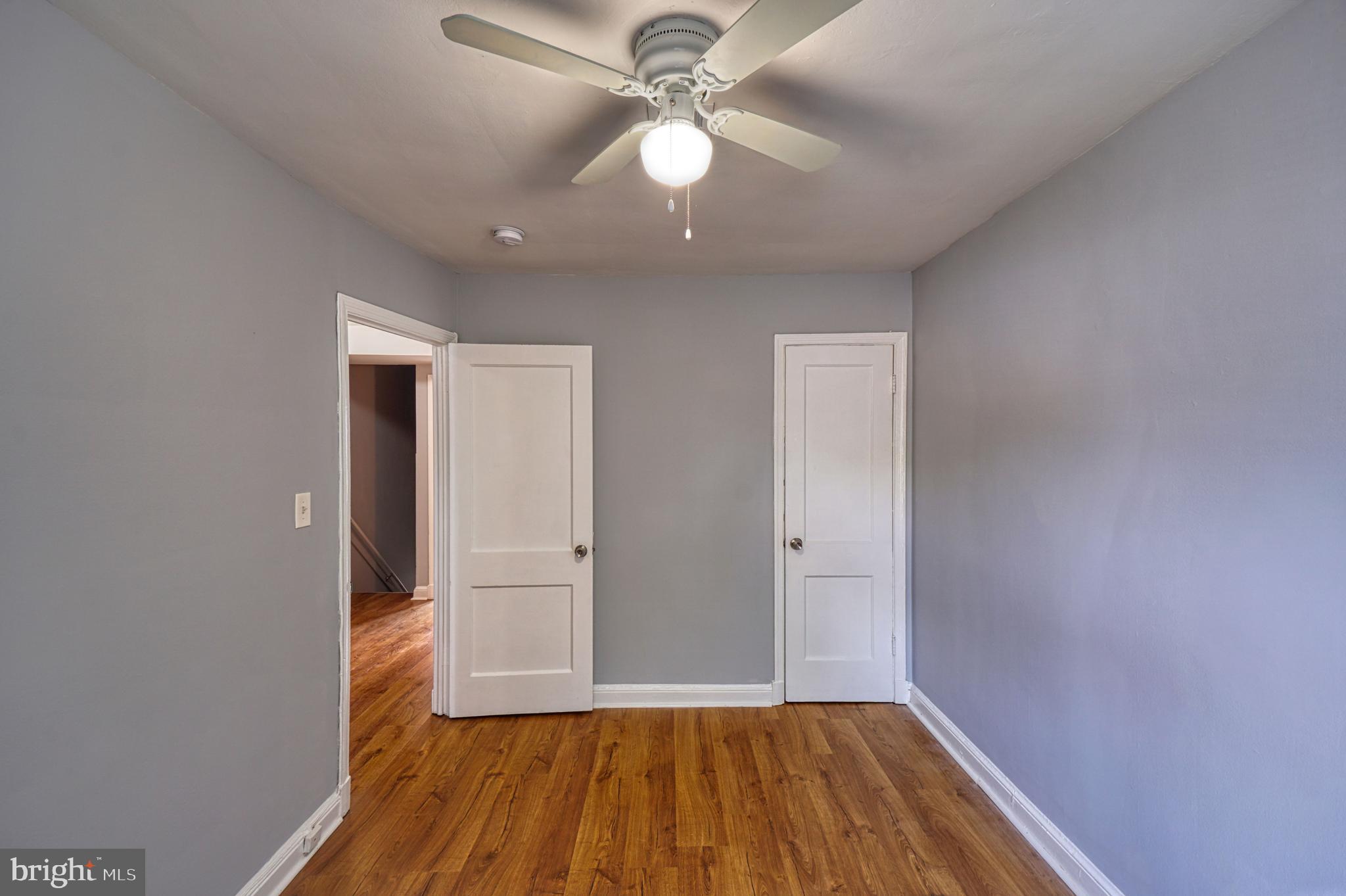 1238 Simms Place Northeast, Unit A Washington, DC 20002 - Photo 10 of 18 wooden floor in an empty room with a window