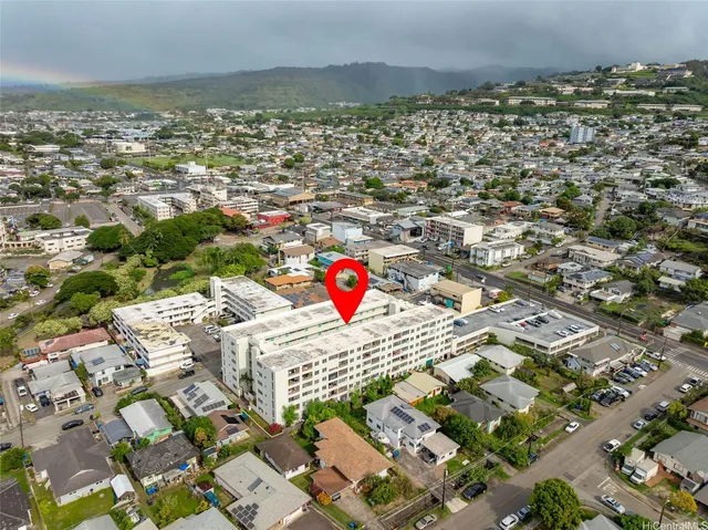 an aerial view of residential houses with outdoor space
