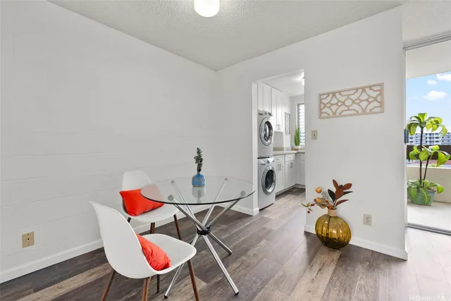a view of a dining room with furniture and wooden floor