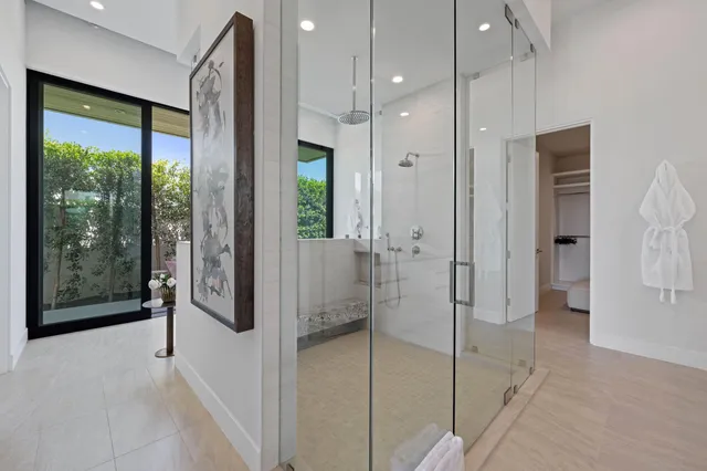 a utility room with cabinets washer and dryer