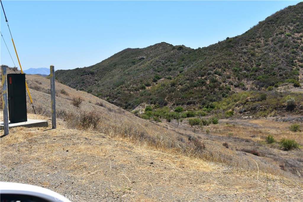 0 Kanan Road Agoura Hills, CA 91301 - Photo 2 of 4 a view of a dry yard with mountains in the background