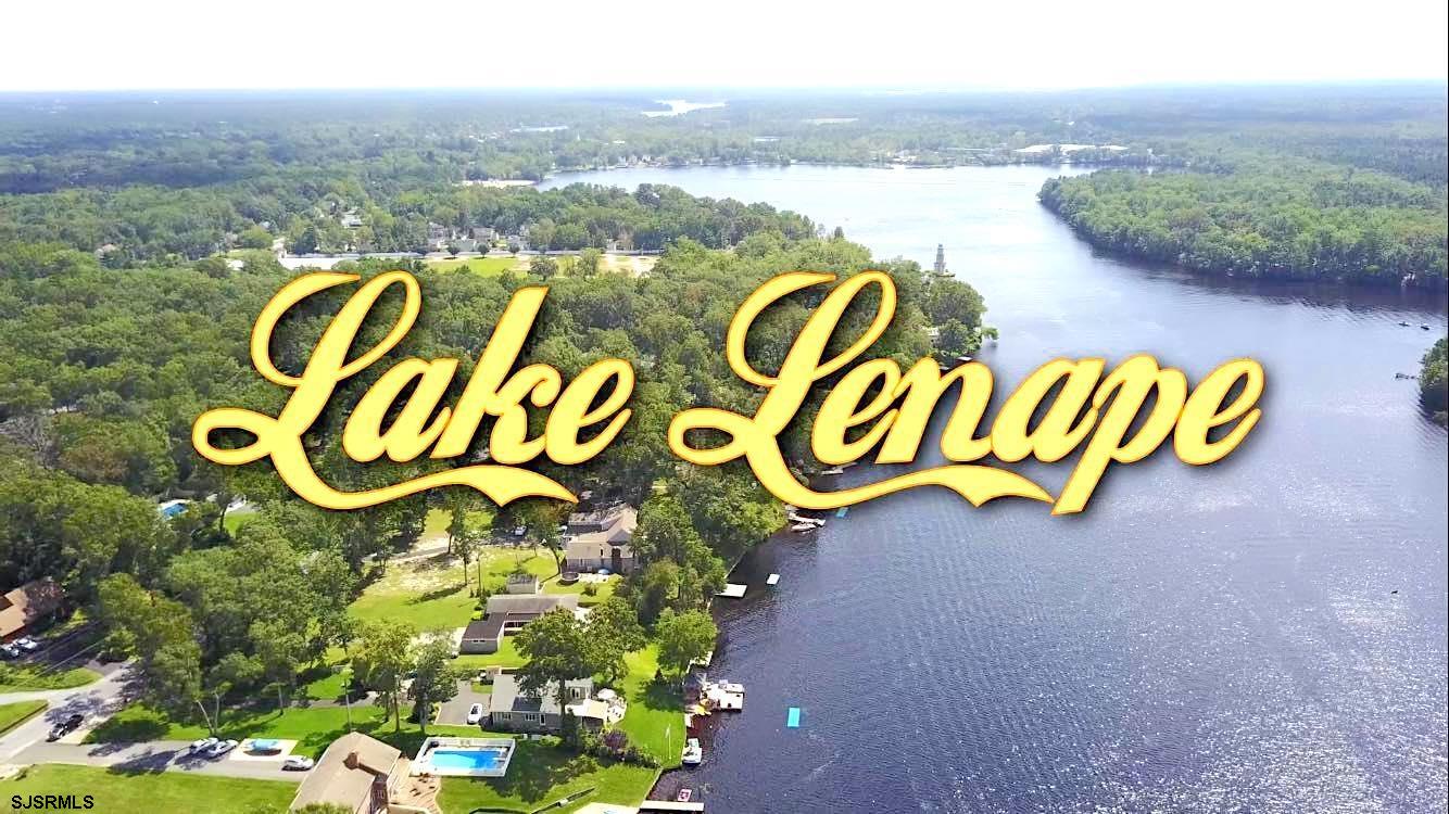 5827 Holly Street Mays Landing, NJ 08330 - Photo 9 of 12 a sign that is sitting in the middle of a lake