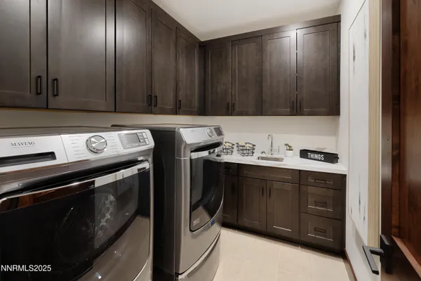 a view of a storage and utility room with washer and dryer