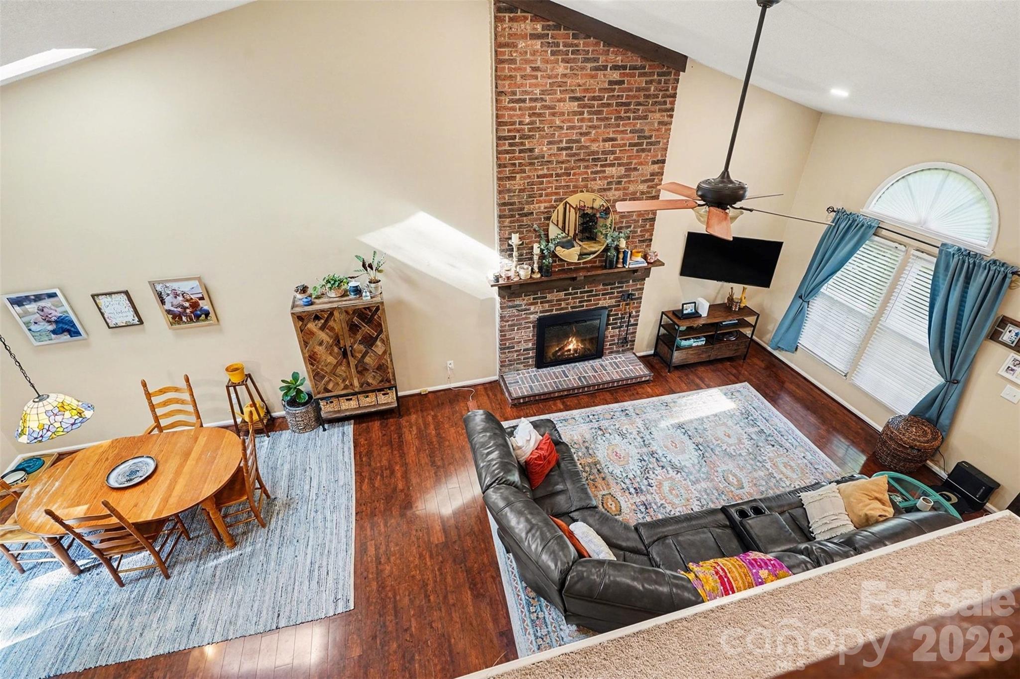 12213 Woodside Falls Road Pineville, NC 28134 - Photo 13 of 28 a living room with furniture and a wooden floor