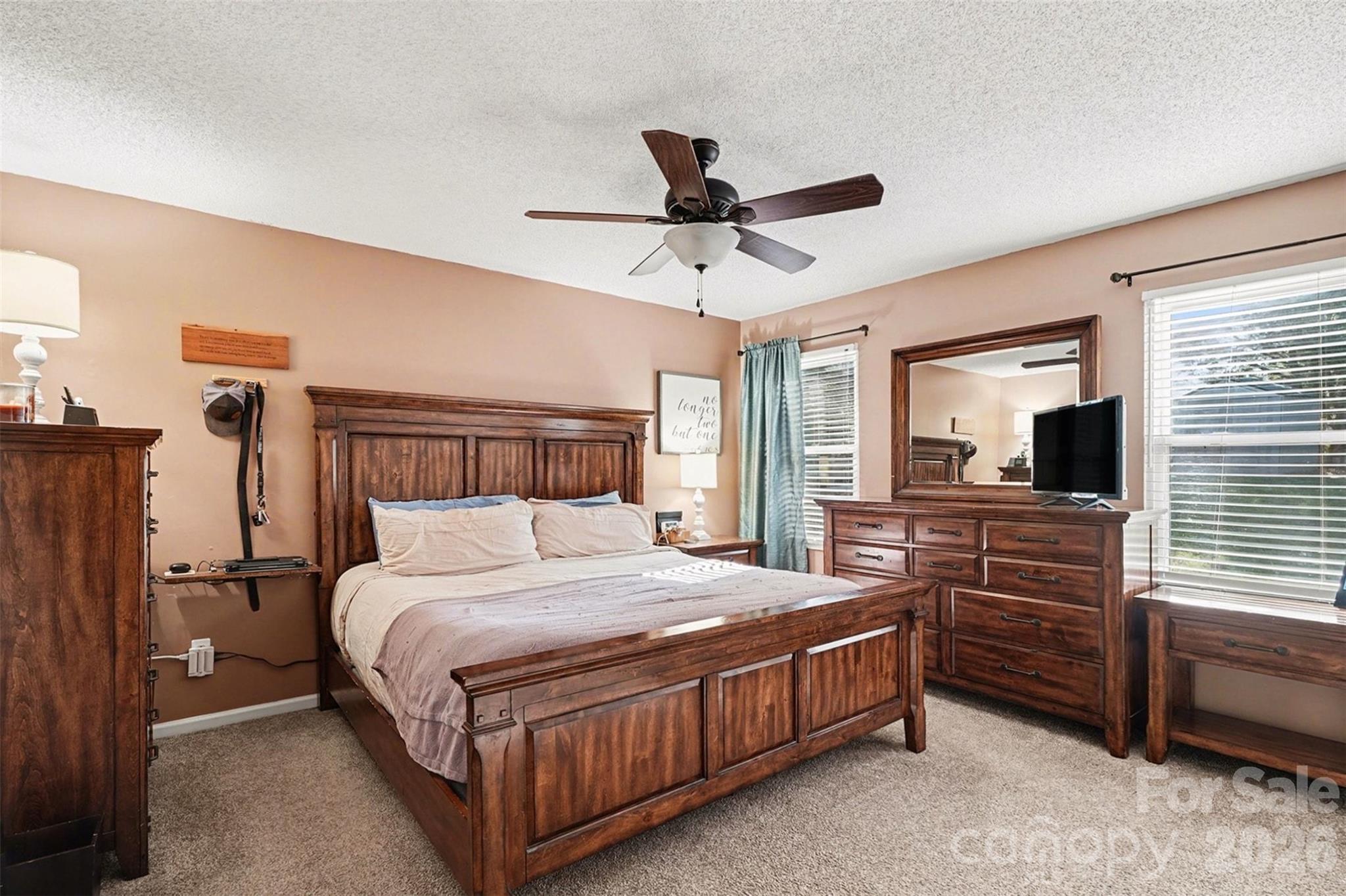12213 Woodside Falls Road Pineville, NC 28134 - Photo 14 of 28 a bedroom with a bed and a window
