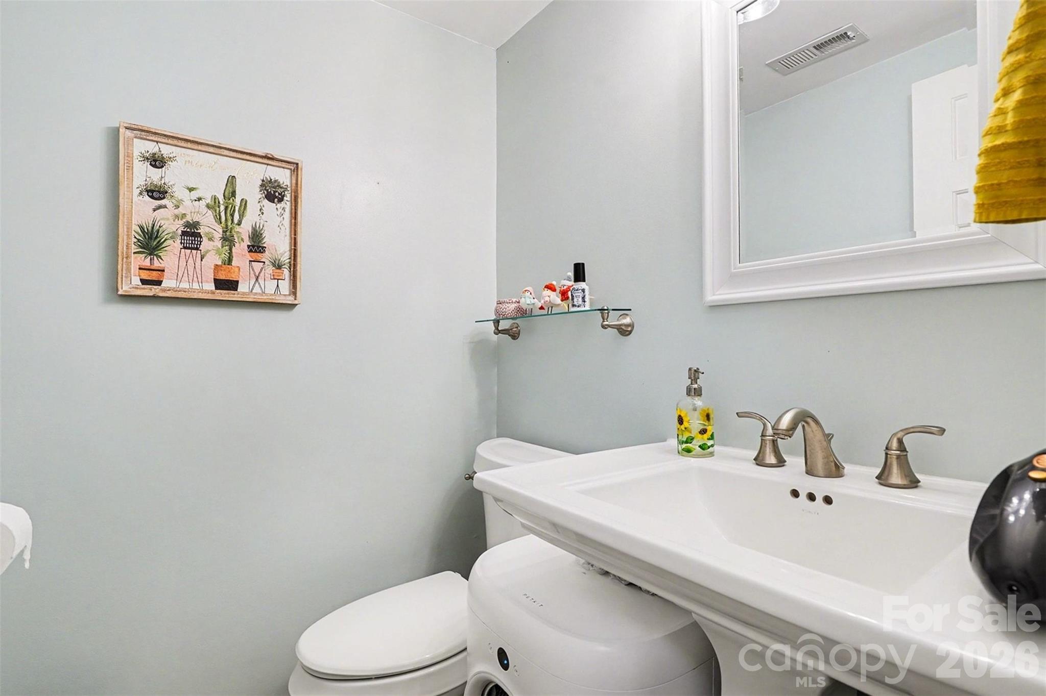 12213 Woodside Falls Road Pineville, NC 28134 - Photo 21 of 28 a bathroom with a sink and a toilet