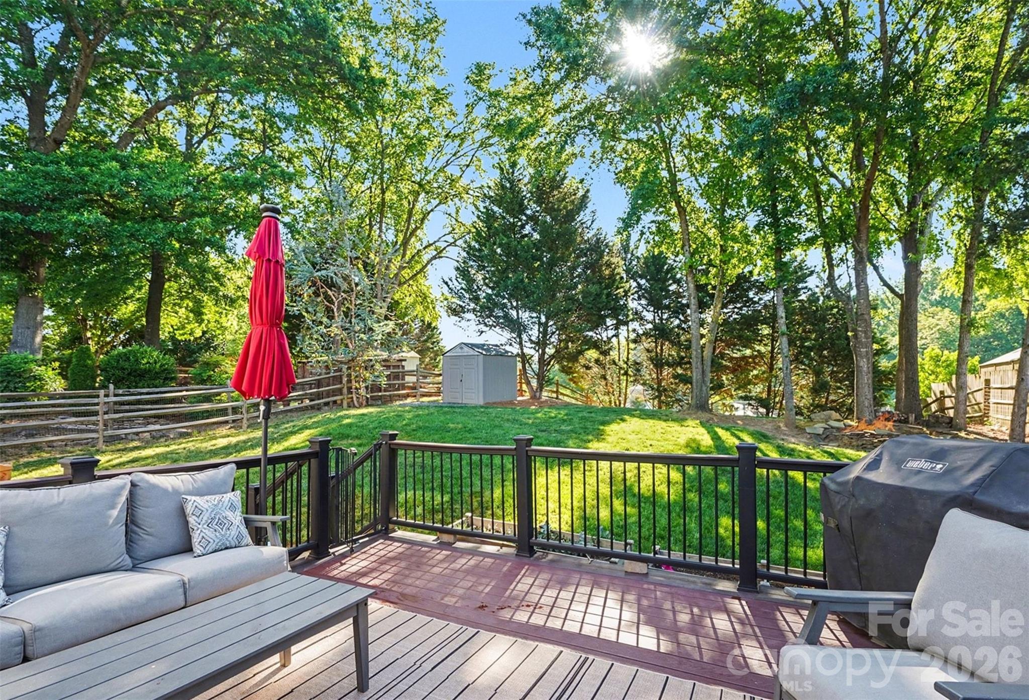 12213 Woodside Falls Road Pineville, NC 28134 - Photo 23 of 28 a view of a bench in the backyard