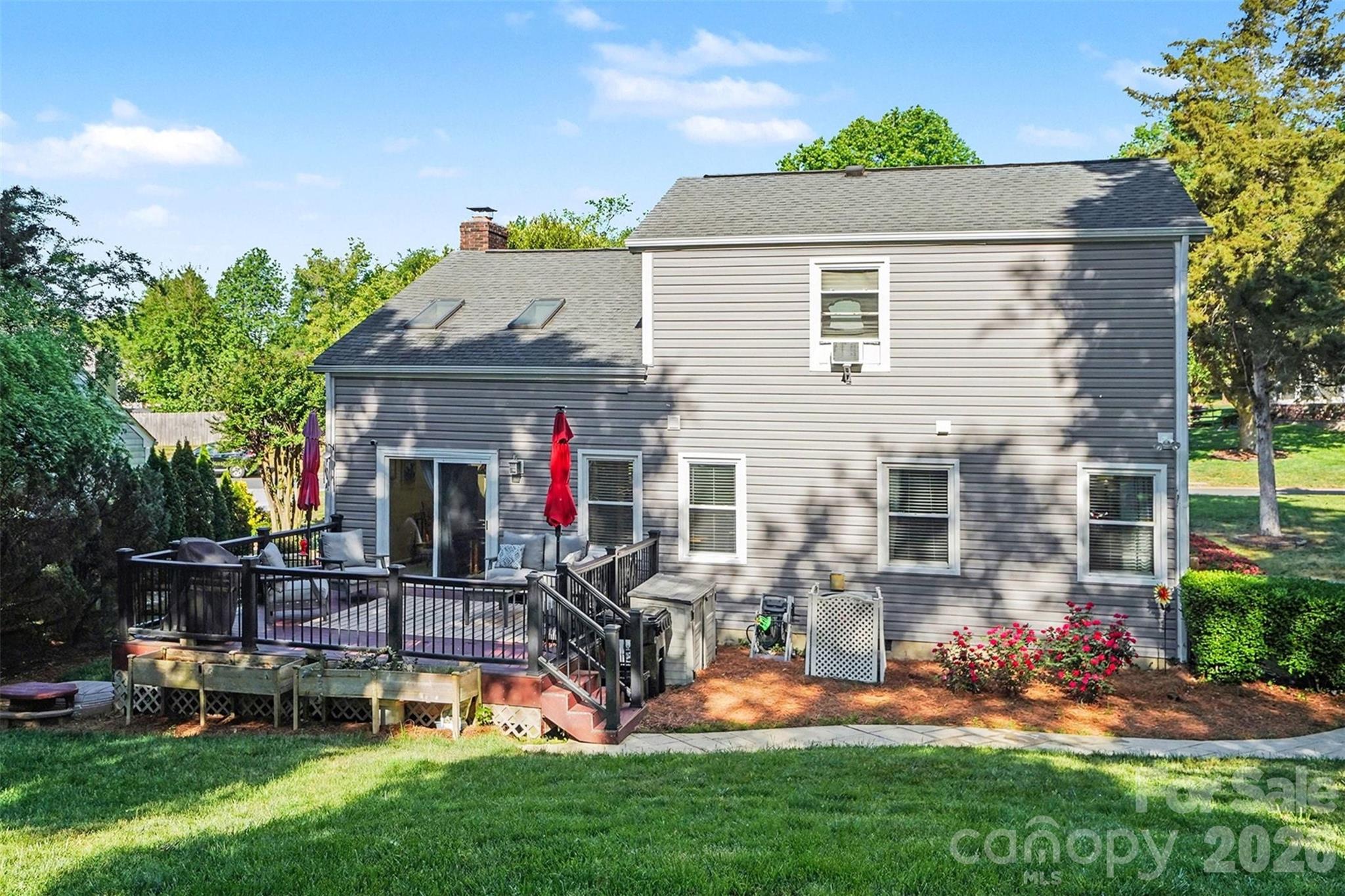 12213 Woodside Falls Road Pineville, NC 28134 - Photo 24 of 28 a front view of house with yard and outdoor seating