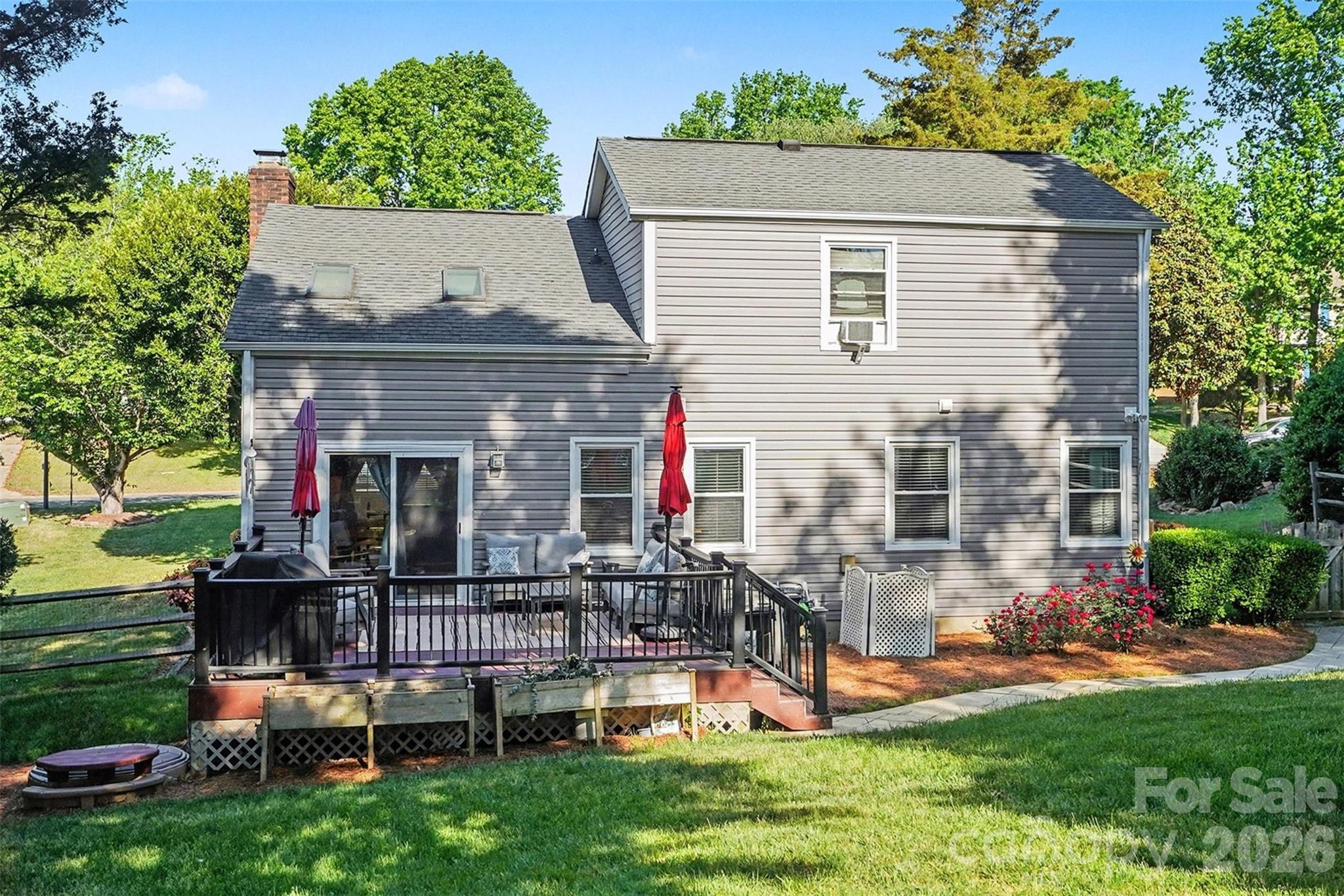 12213 Woodside Falls Road Pineville, NC 28134 - Photo 25 of 28 front view of house with a yard and outdoor seating