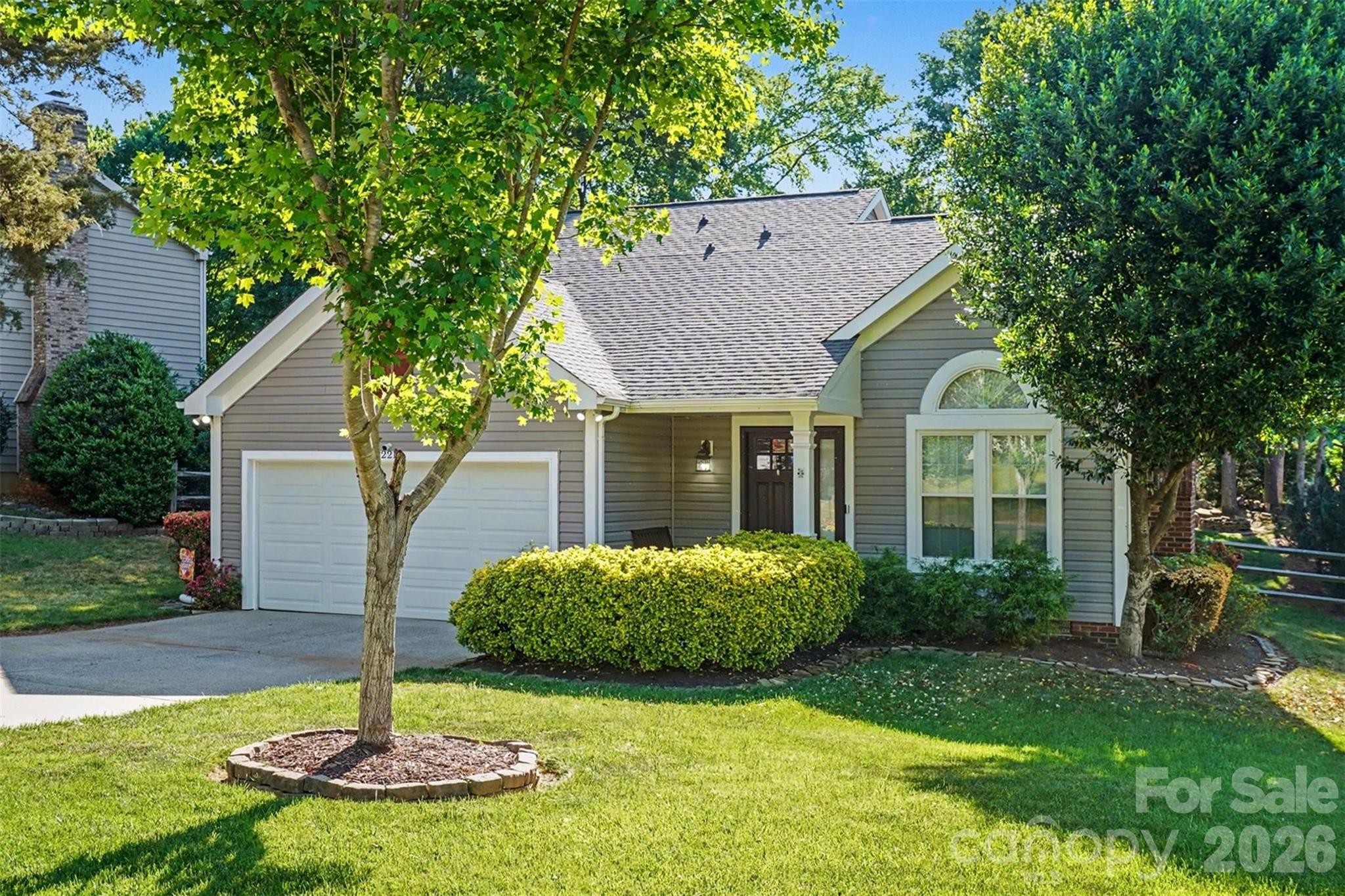 12213 Woodside Falls Road Pineville, NC 28134 - Photo 3 of 28 a front view of house with yard and green space