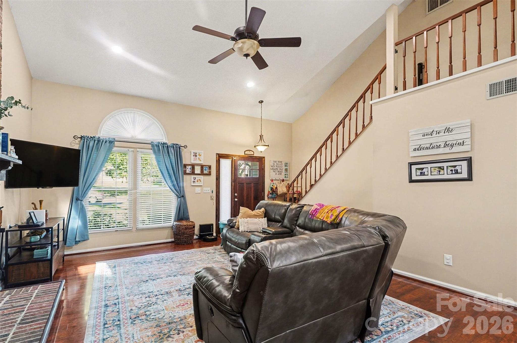12213 Woodside Falls Road Pineville, NC 28134 - Photo 6 of 28 a living room with furniture a window and a flat screen tv