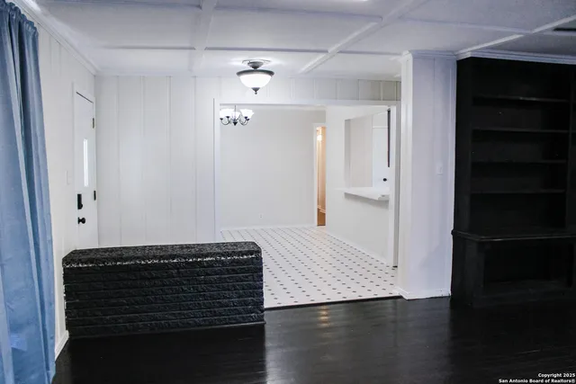 a view of room with wooden floor