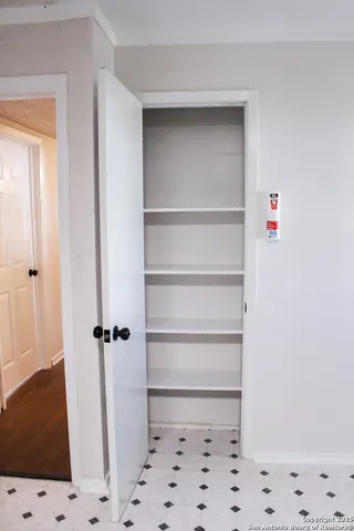 a walk in closet with a vanity