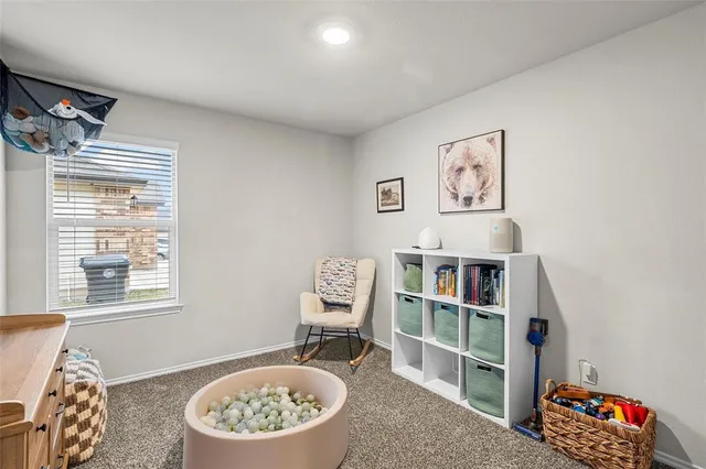 a view of a livingroom with furniture and a window
