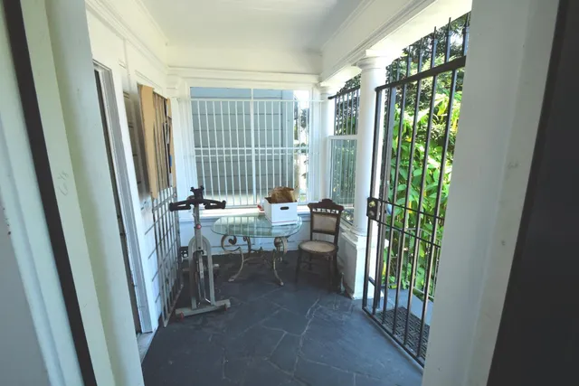a view of a hallway with furniture and entryway