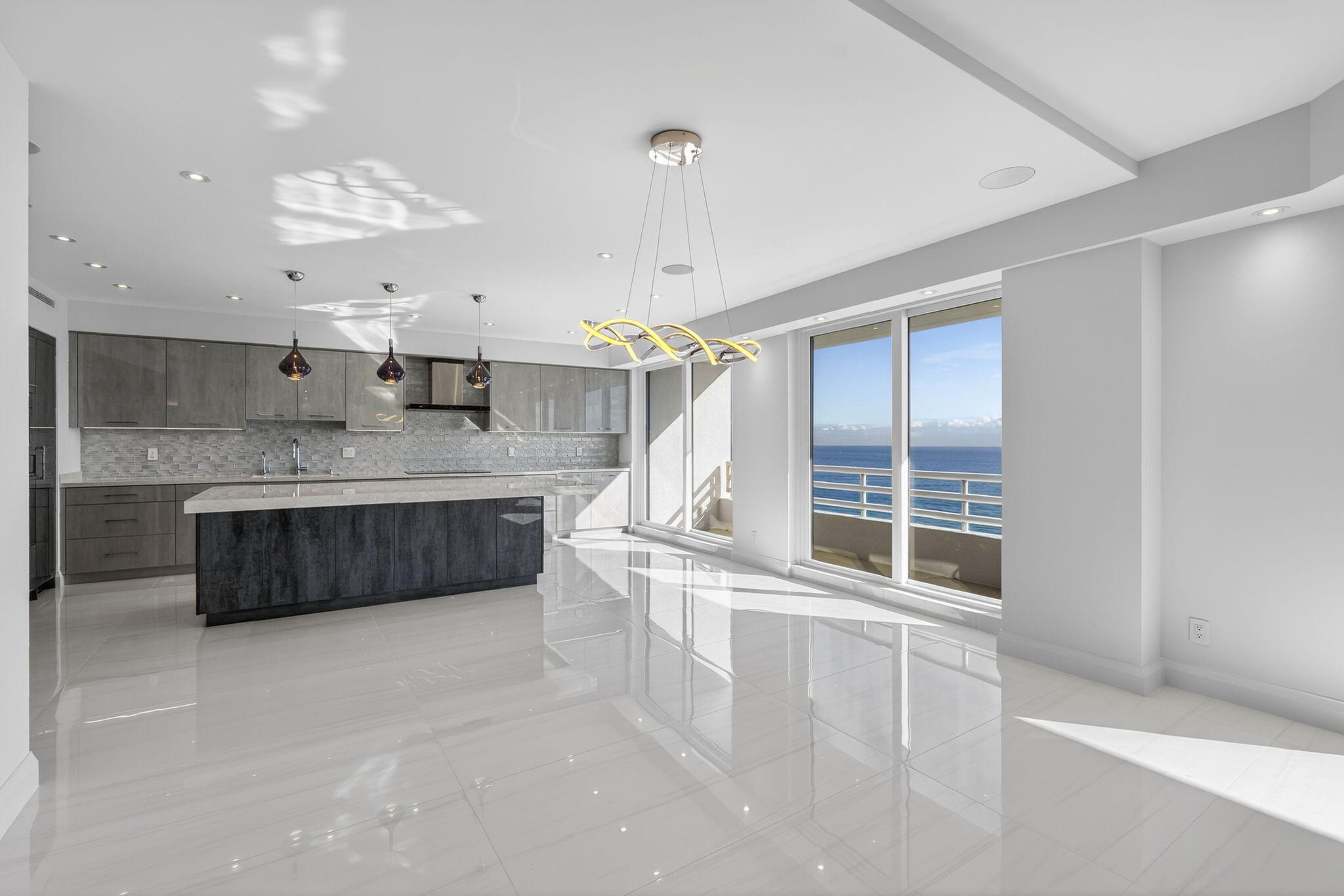 1500 South Ocean Boulevard, Unit 1602 Boca Raton, FL 33432 - Photo 17 of 88 a large white kitchen with a large window
