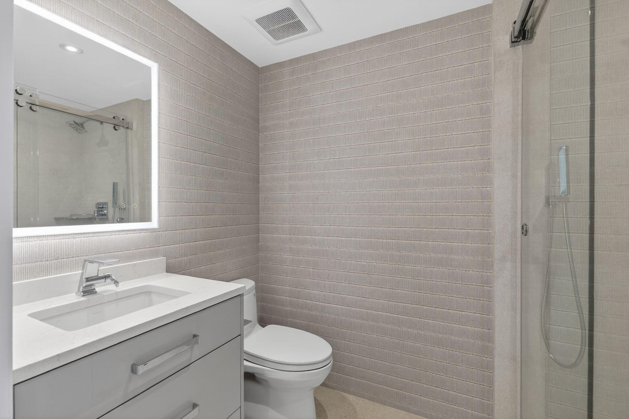 1500 South Ocean Boulevard, Unit 1602 Boca Raton, FL 33432 - Photo 38 of 88 a bathroom with a sink a toilet and a mirror