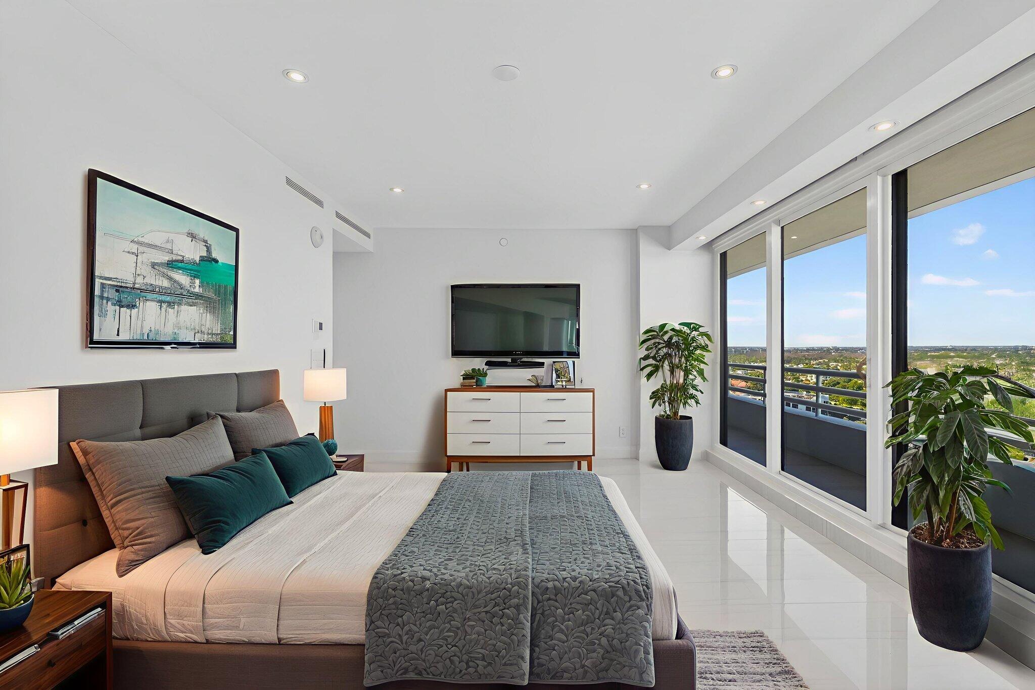 1500 South Ocean Boulevard, Unit 1602 Boca Raton, FL 33432 - Photo 41 of 88 a bedroom with a bed and a flat screen tv