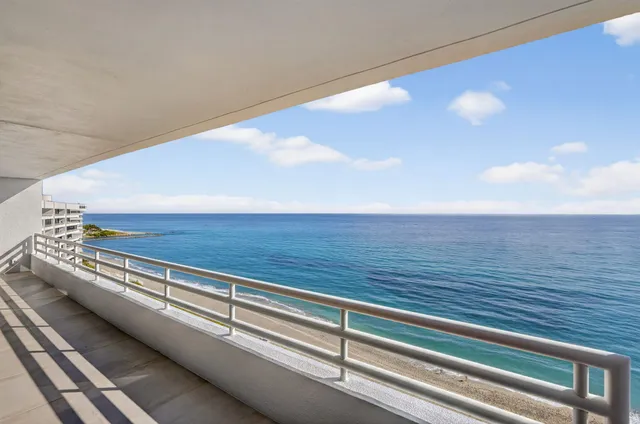 a kitchen with kitchen island a counter top space a sink stainless steel appliances and cabinets