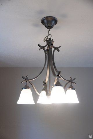 634 South 2100th Street West Vernal, UT 84078 - Photo 8 of 71 Bronze-finish chandelier with four frosted glass bell-shaped shades