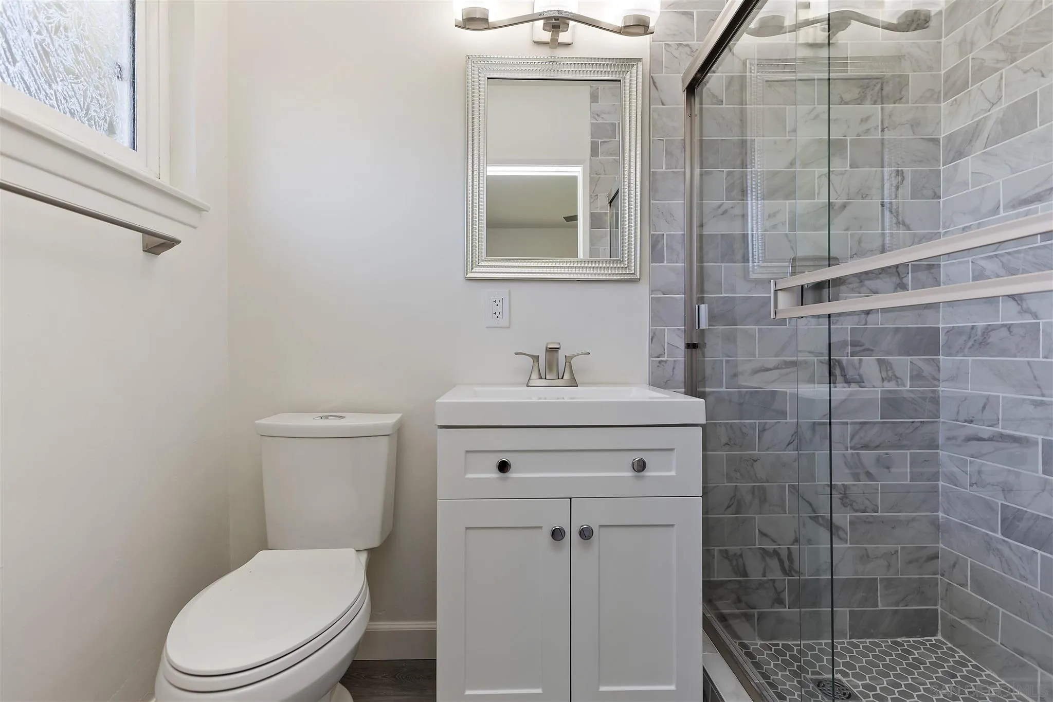 2956 Ronald Street Riverside, CA 92506 - Photo 21 of 28 a bathroom with a toilet sink and shower