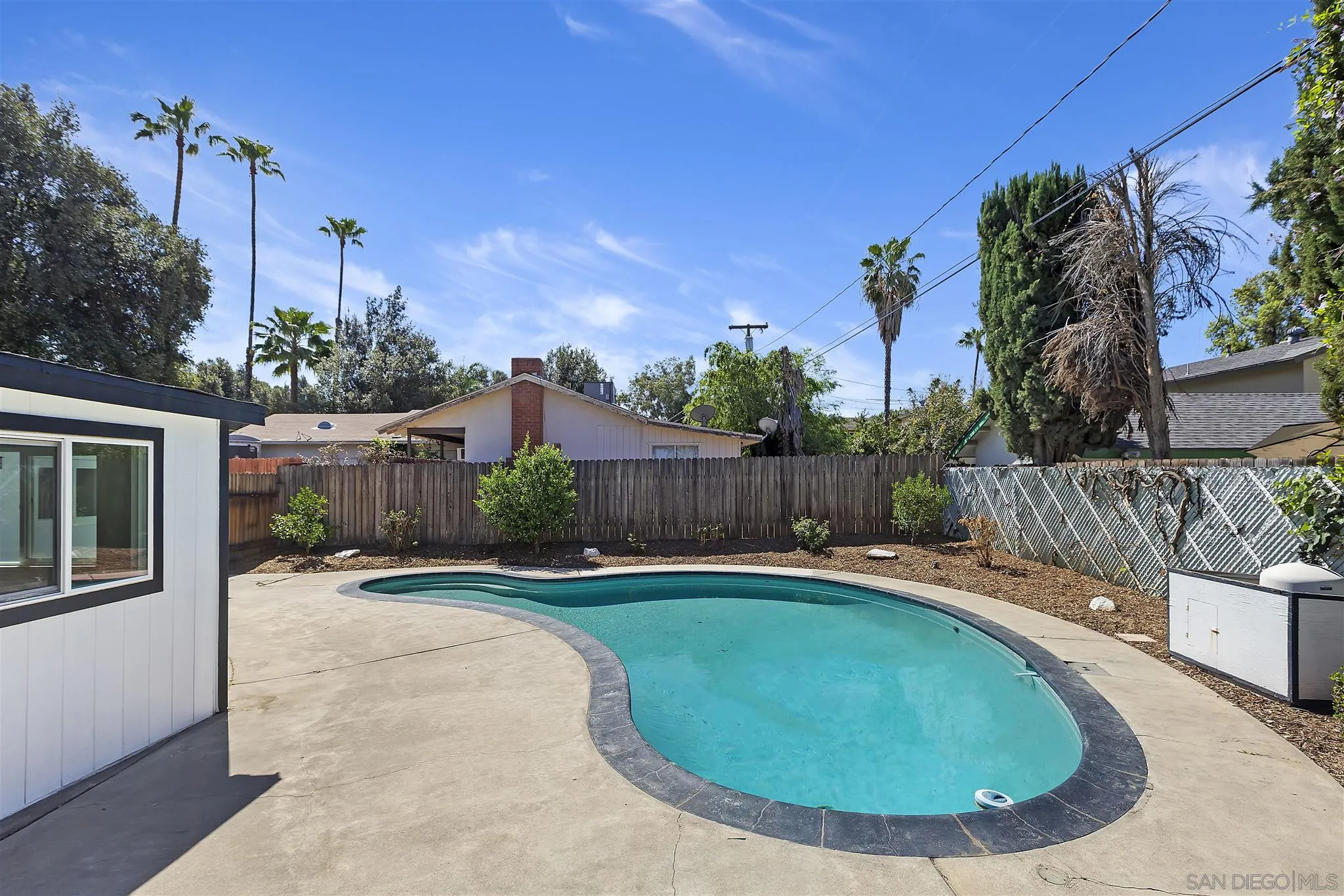 2956 Ronald Street Riverside, CA 92506 - Photo 25 of 28 a swimming pool with outdoor seating and yard