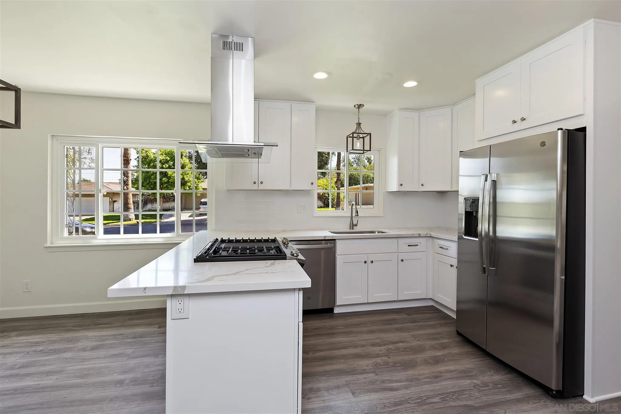 2956 Ronald Street Riverside, CA 92506 - Photo 6 of 28 a kitchen with granite countertop a sink stainless steel appliances and window