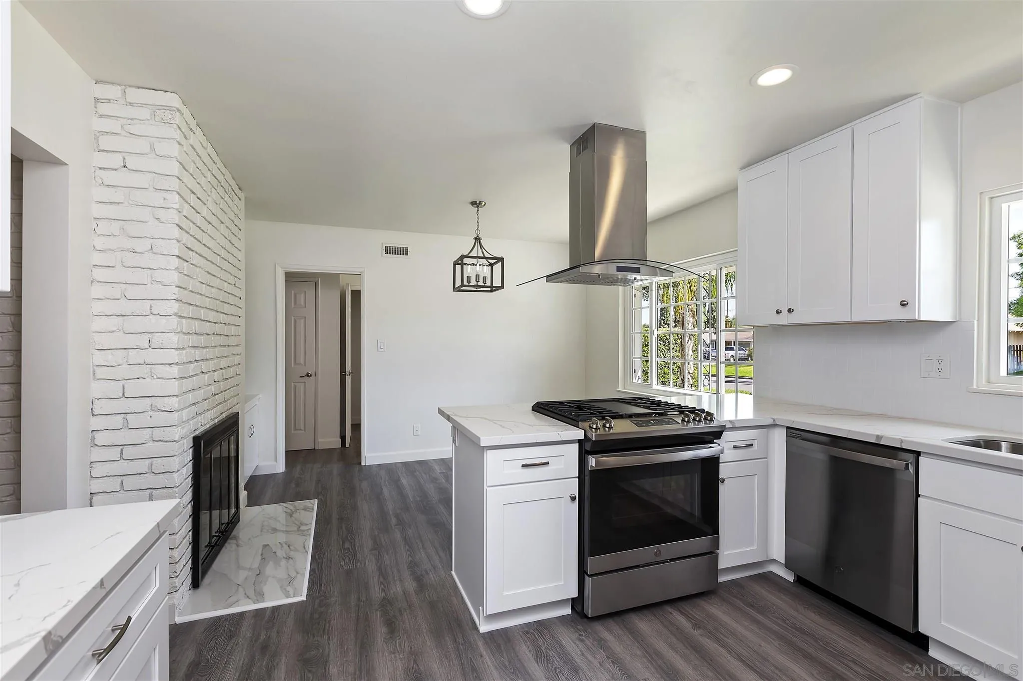 2956 Ronald Street Riverside, CA 92506 - Photo 7 of 28 a kitchen with a stove and a sink